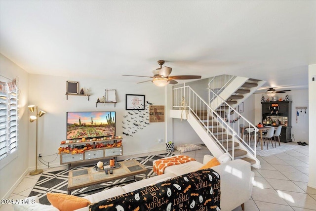 tiled living room with ceiling fan