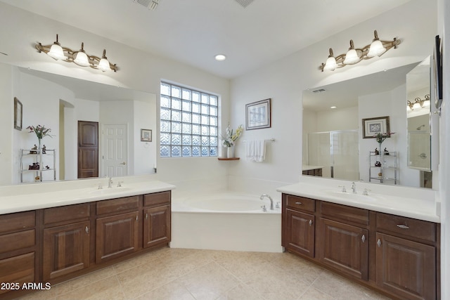 bathroom featuring tile patterned flooring, plus walk in shower, and vanity