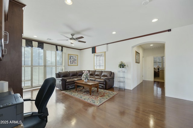 living room with crown molding, ceiling fan, floor to ceiling windows, and dark hardwood / wood-style floors