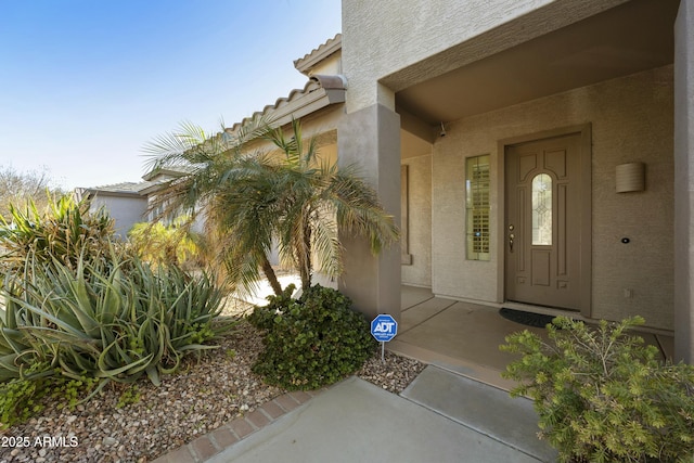 property entrance featuring a patio