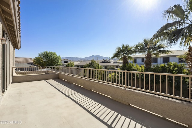 balcony with a patio and a mountain view