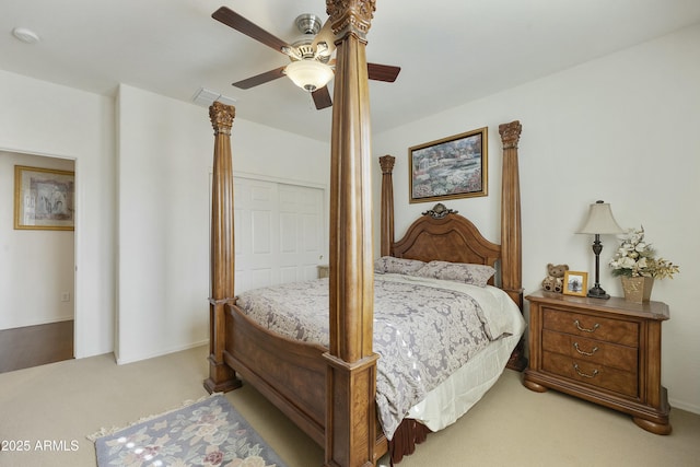 bedroom featuring ceiling fan and light colored carpet