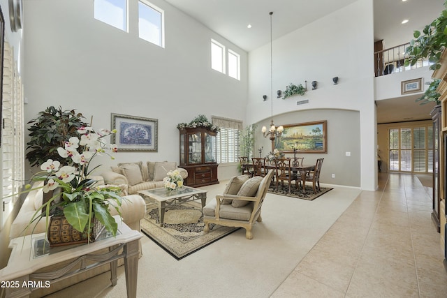 living room featuring light tile patterned floors and a notable chandelier