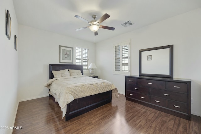 bedroom featuring dark wood-type flooring and ceiling fan