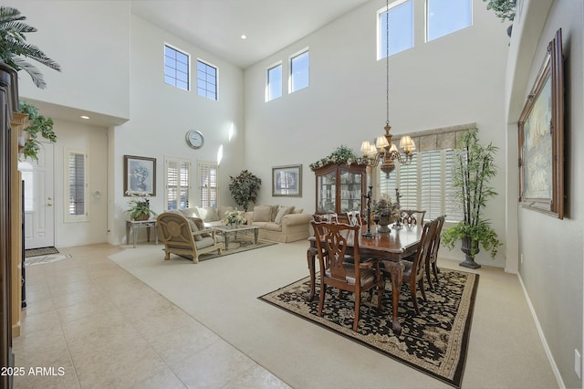 tiled dining space with a chandelier