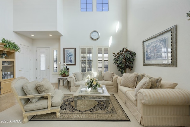 living room featuring a towering ceiling