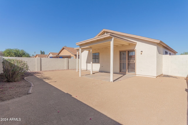 rear view of property with a patio area