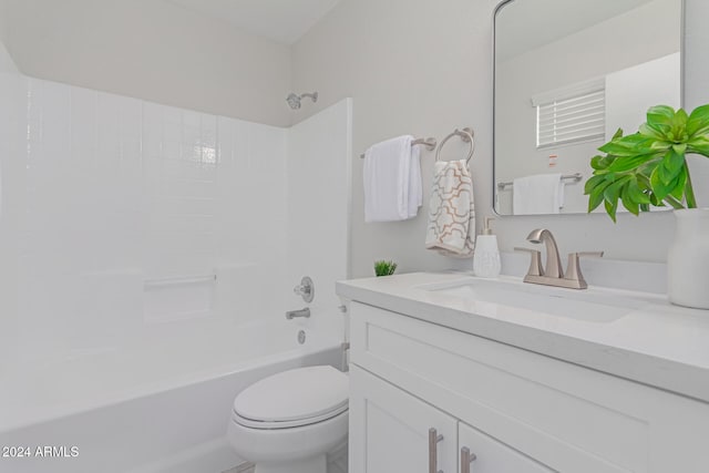 full bathroom featuring shower / bathing tub combination, vanity, and toilet