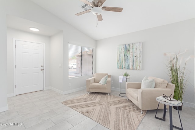 sitting room with ceiling fan and lofted ceiling