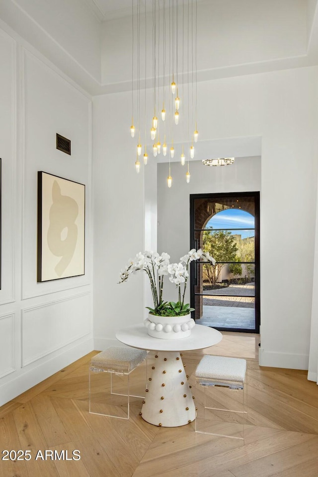 unfurnished dining area featuring visible vents and baseboards