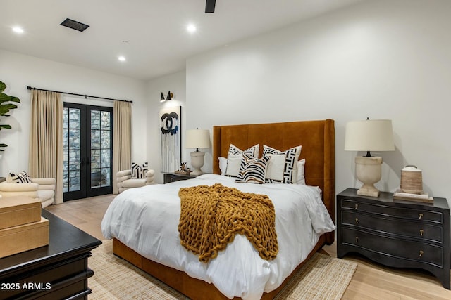 bedroom with recessed lighting, light wood-style floors, access to outside, and french doors