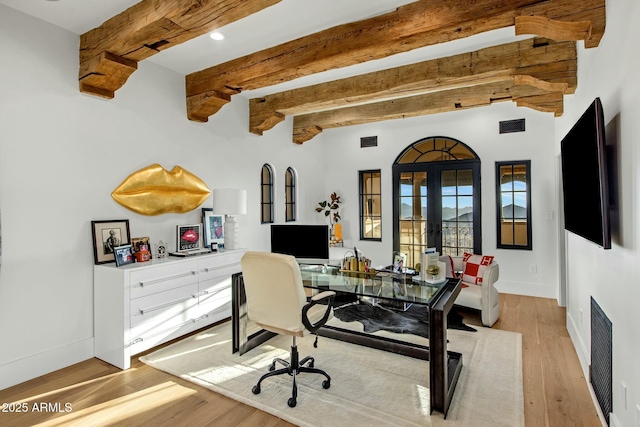 home office featuring french doors, beamed ceiling, light wood-type flooring, and visible vents