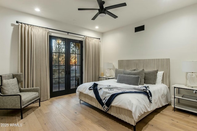 bedroom featuring access to outside, french doors, and light wood-style flooring