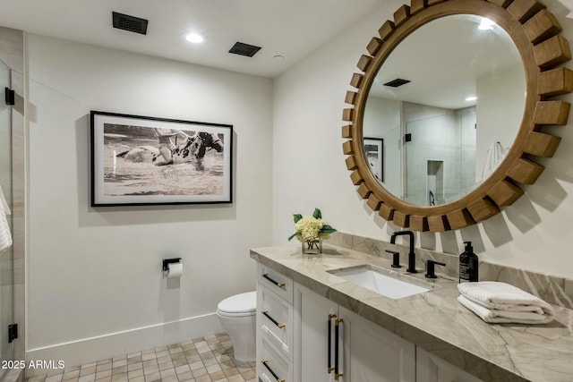 bathroom with toilet, baseboards, visible vents, and vanity