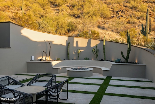 view of patio / terrace featuring a fire pit