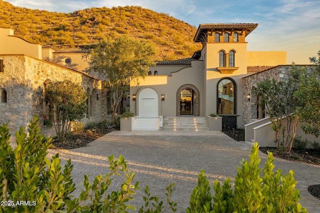 mediterranean / spanish-style house featuring stucco siding