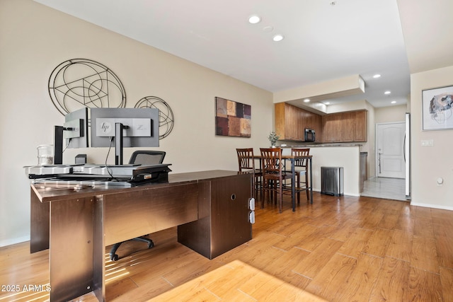 office with recessed lighting, light wood-type flooring, and baseboards