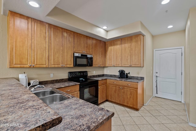 kitchen featuring a sink, black appliances, light tile patterned flooring, and recessed lighting