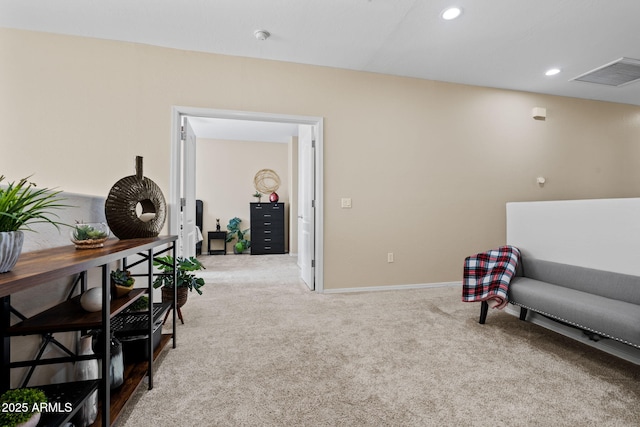 living area featuring visible vents, recessed lighting, baseboards, and carpet