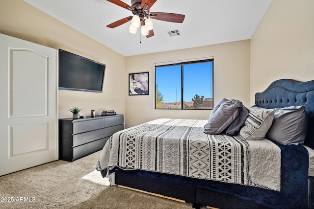 carpeted bedroom with visible vents and ceiling fan