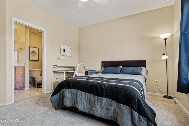 carpeted bedroom featuring tile patterned flooring, connected bathroom, baseboards, and ceiling fan