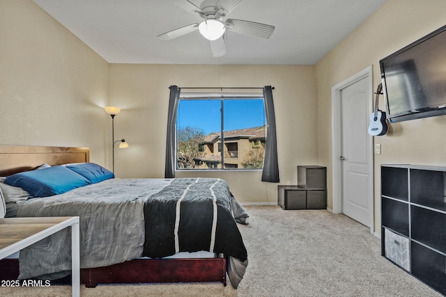 bedroom with baseboards, carpet, and a ceiling fan