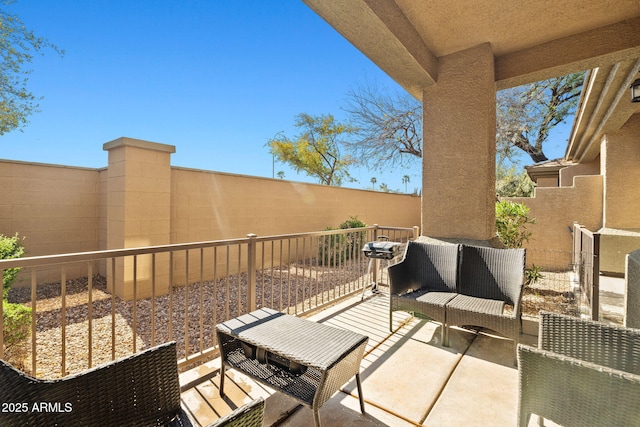 view of patio featuring a balcony