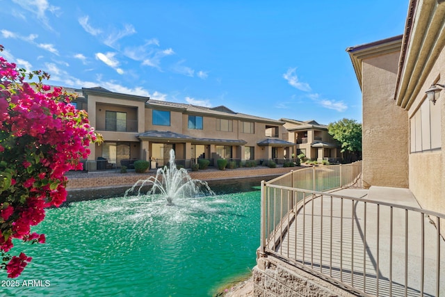 view of pool with a residential view