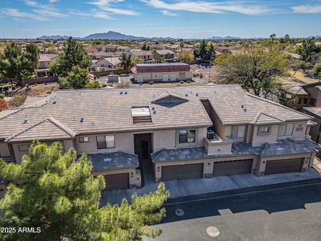 birds eye view of property with a mountain view and a residential view