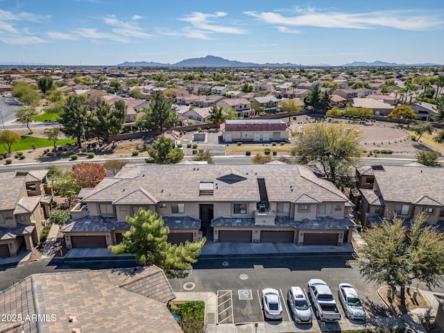 birds eye view of property with a mountain view and a residential view