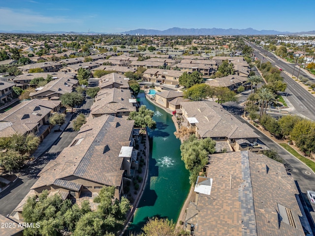 aerial view featuring a residential view and a water and mountain view