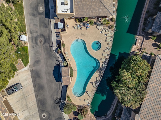 birds eye view of property with a water view