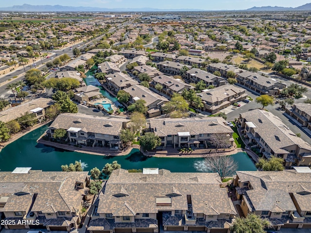 birds eye view of property with a residential view and a water view