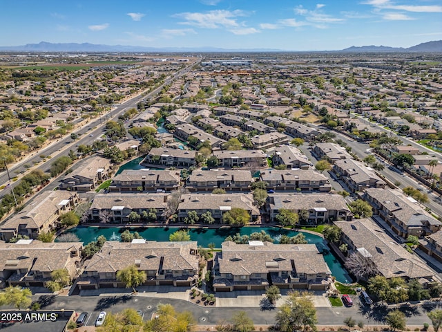 bird's eye view with a residential view and a water and mountain view