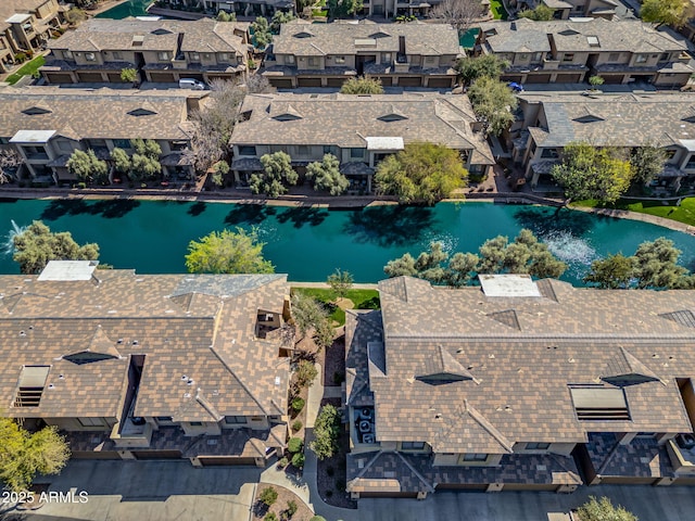 aerial view with a residential view and a water view