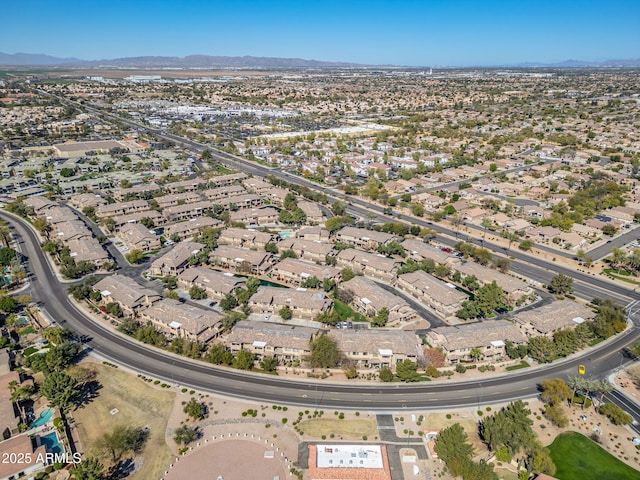 birds eye view of property with a mountain view and a residential view