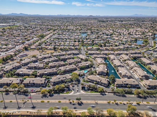 birds eye view of property with a residential view and a water and mountain view