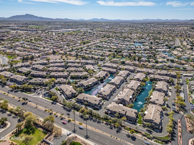 drone / aerial view with a residential view and a water and mountain view