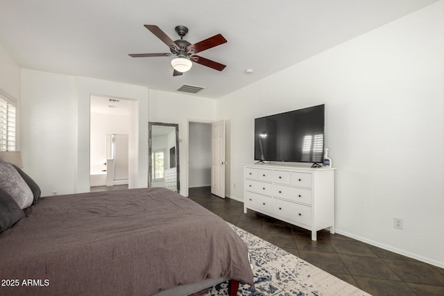 bedroom with visible vents, baseboards, ceiling fan, and ensuite bath