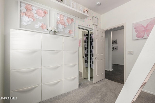 unfurnished bedroom with a closet and carpet flooring