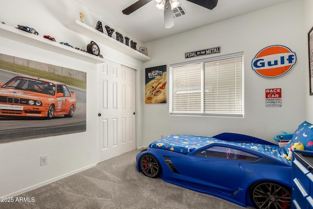 bedroom with visible vents, a closet, baseboards, ceiling fan, and carpet flooring