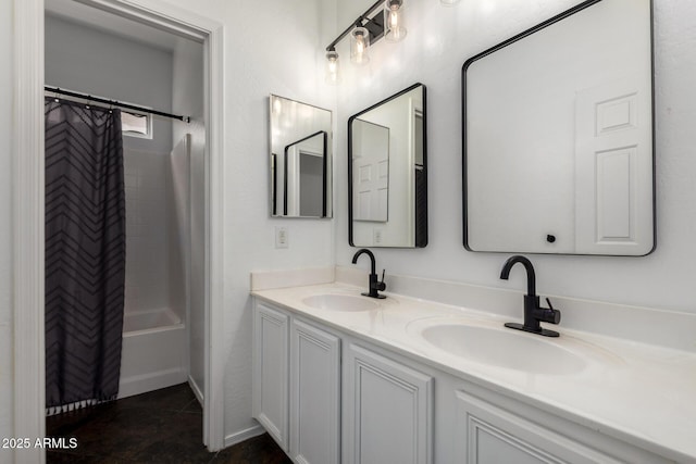 bathroom with double vanity, a sink, and shower / tub combo