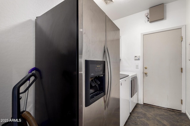 washroom featuring laundry area, visible vents, and washing machine and clothes dryer