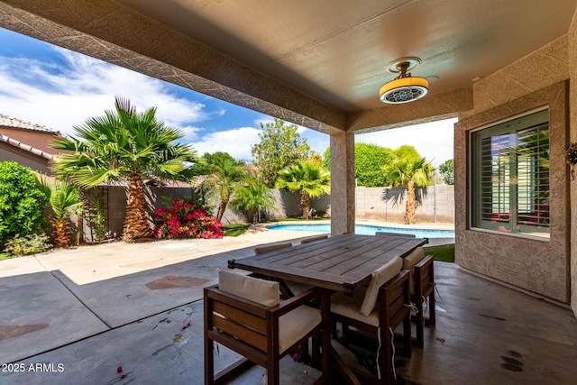 view of patio / terrace featuring a fenced in pool, outdoor dining area, and a fenced backyard