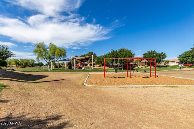 communal playground featuring a yard