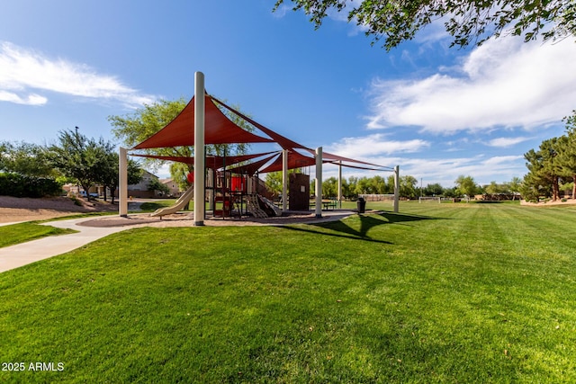 surrounding community with a yard and playground community