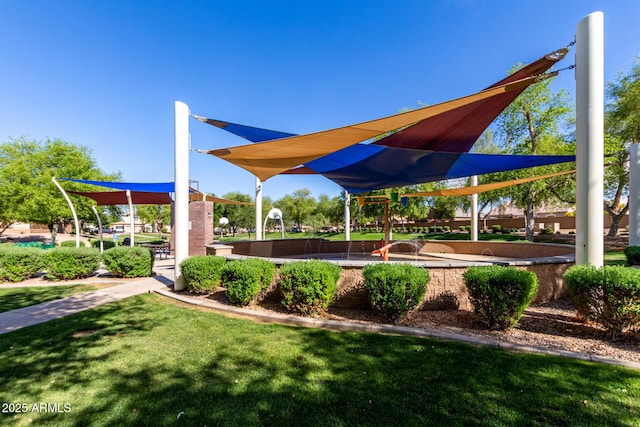 view of property's community with a lawn