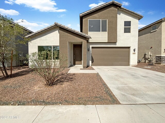 view of front of property with a garage