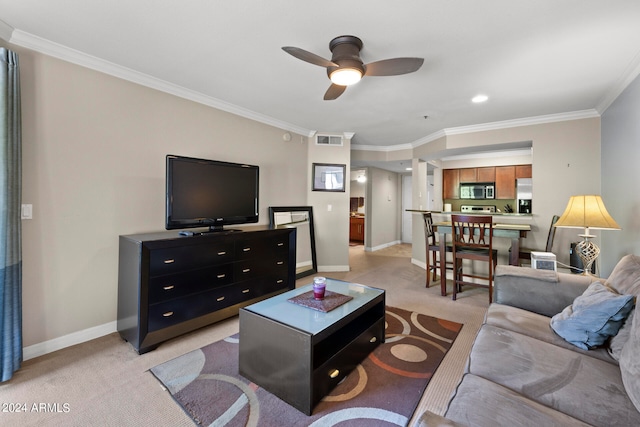 carpeted living room featuring crown molding and ceiling fan