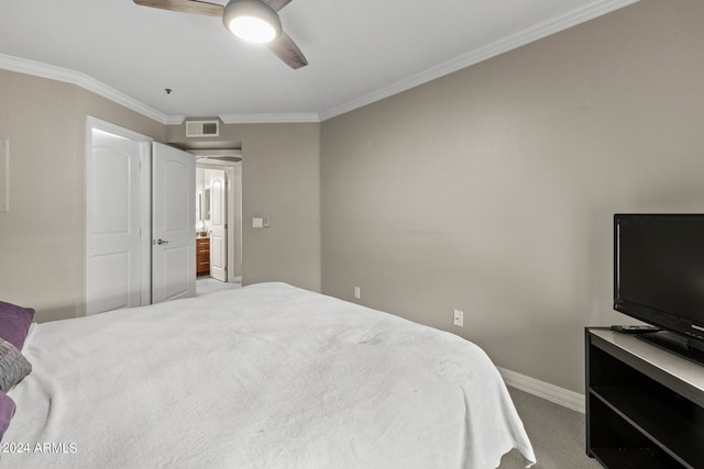 carpeted bedroom featuring crown molding and ceiling fan